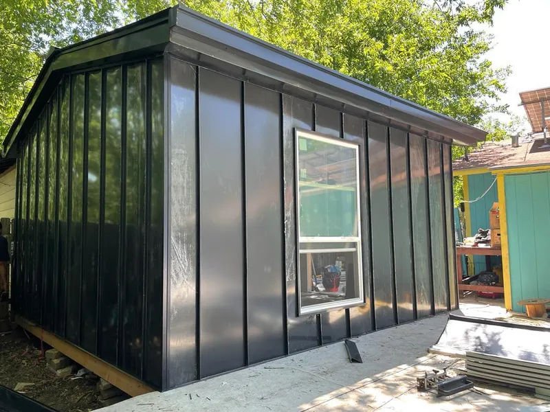 Black standing seam metal wall panels for Roof Inspection in Buda