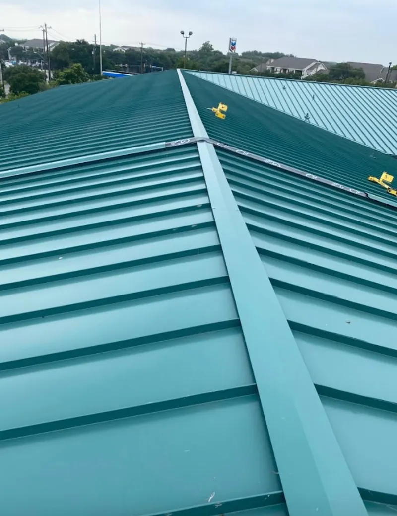 Green commercial metal roof ridge and valley for Metal Roof Repair in Buda